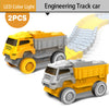 Two yellow and gray engineering track cars are shown, with a long track of gray blocks extending behind them.