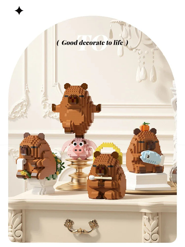 A set of cute brown bear and pink capybara micro building blocks displayed on a white surface.