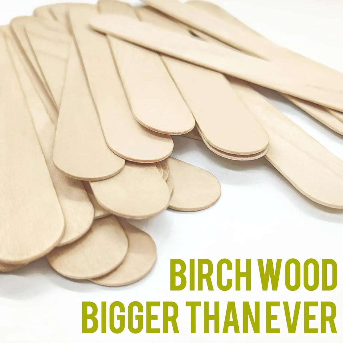 A pile of light-colored birch wood stir sticks for craft mixing and resin work.