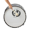 A hand is shown striking a white bass drum with a felt mallet, featuring an ornate design and silver hardware.