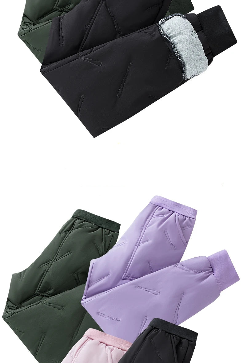 A collection of kids waterproof winter pants in various colors including black, dark green, and purple.