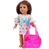 A doll with long brown hair wearing a white and pink floral dress and holding a bright pink handbag.