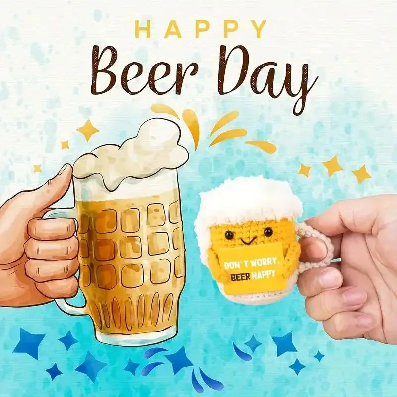 A hand holds a glass of beer with foam and a hand holds a crochet beer mug buddy with a funny card for Beer Day.
