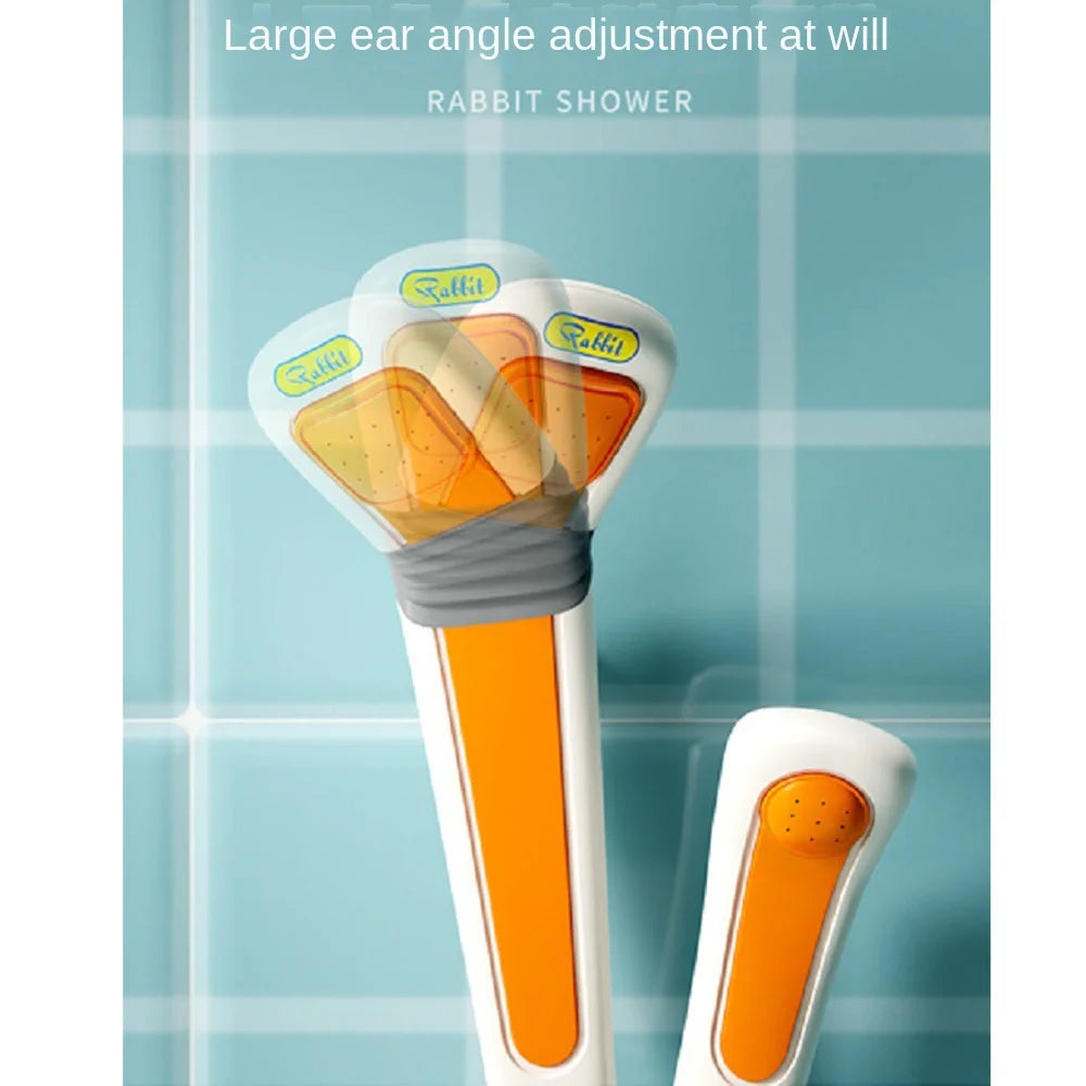 A white rabbit-shaped electric bath shower toy with an orange body and multiple spray nozzles.