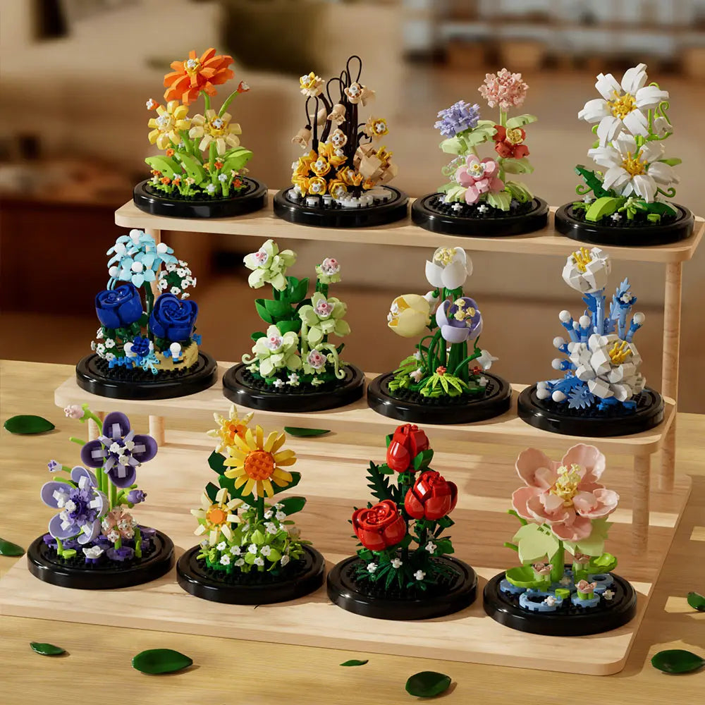 A collection of buildable eternal rose flower kits featuring various colored and styled flowers in pots.