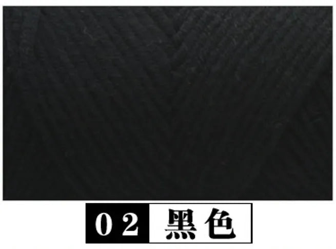 A swatch of black yarn labeled 02 Black.