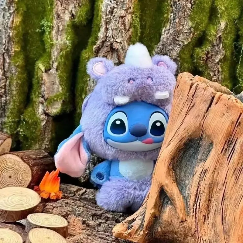 A purple and blue Stitch plush blind box collectible pendant resting on a wooden surface next to a tree trunk.