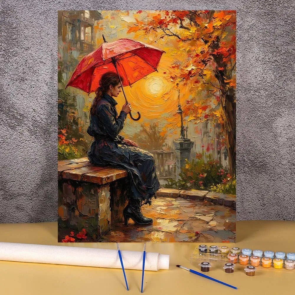 A painting by numbers kit showing an elegant woman in a dark coat holding a red umbrella against a bright autumn background.