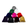 A collection of colorful drawstring dice bags including black, purple, pink, red, green, and white bags.