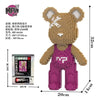 A small bear-shaped building block set made of pink and tan plastic pieces.