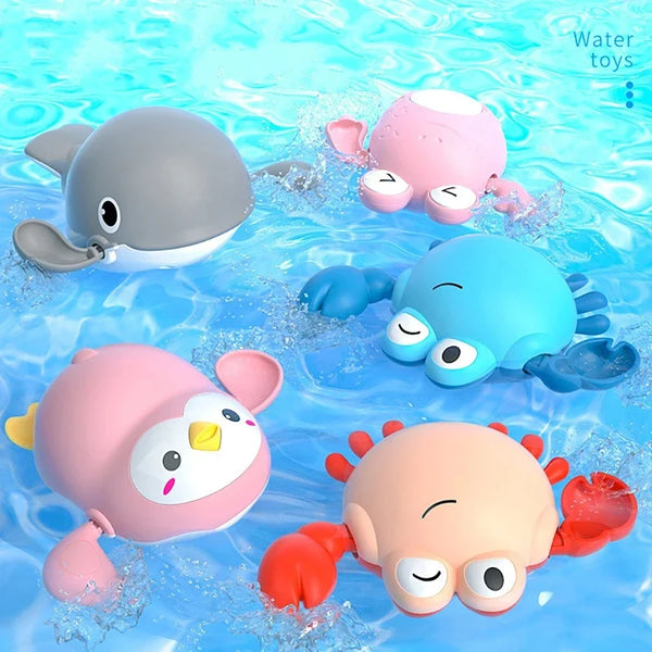 Collection de jouets pour bain d'animaux roses et bleus flottant dans l'eau claire.