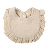A light beige ruffled muslin cotton baby bib with an adjustable snap closure.
