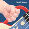A hand is holding the red handle design of a ukulele toy, showing its grip and part of the instrument's body.