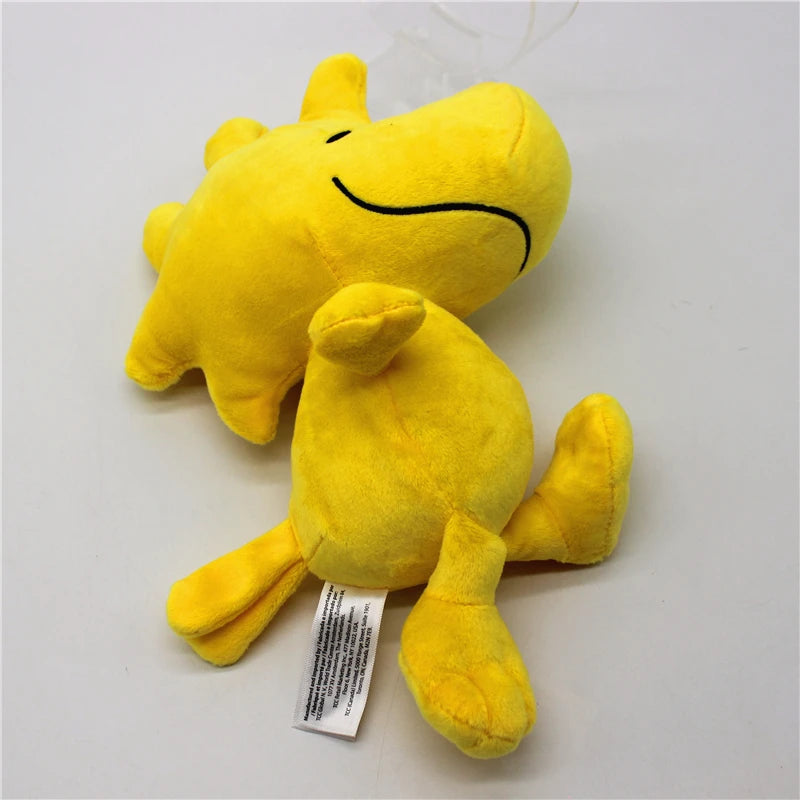 A yellow Snoopy and Woodstock plush set featuring a dog-like character and a bird, displayed against a white background.