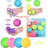 Colorful squishy stress balls in blue, pink, green, yellow, and purple are shown with hands for size comparison.