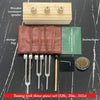 A set of tuning forks including a wooden resonance speaker, a leather storage bag, and various tuning forks for sound healing