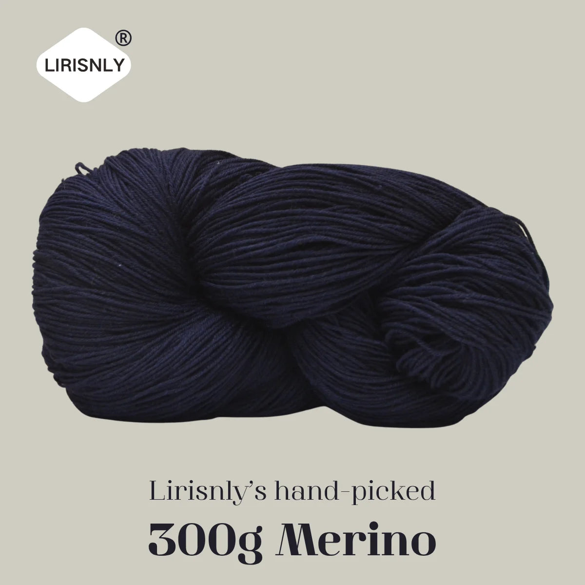 A ball of dark navy merino wool yarn labeled Lirisnly's hand-picked 300g Merino.