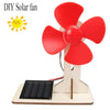 A DIY solar fan project showing a red fan attached to a wooden structure and a solar panel.