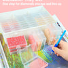 A set of 30 diamond storage containers and trays organized in a white rack for storing diamonds.