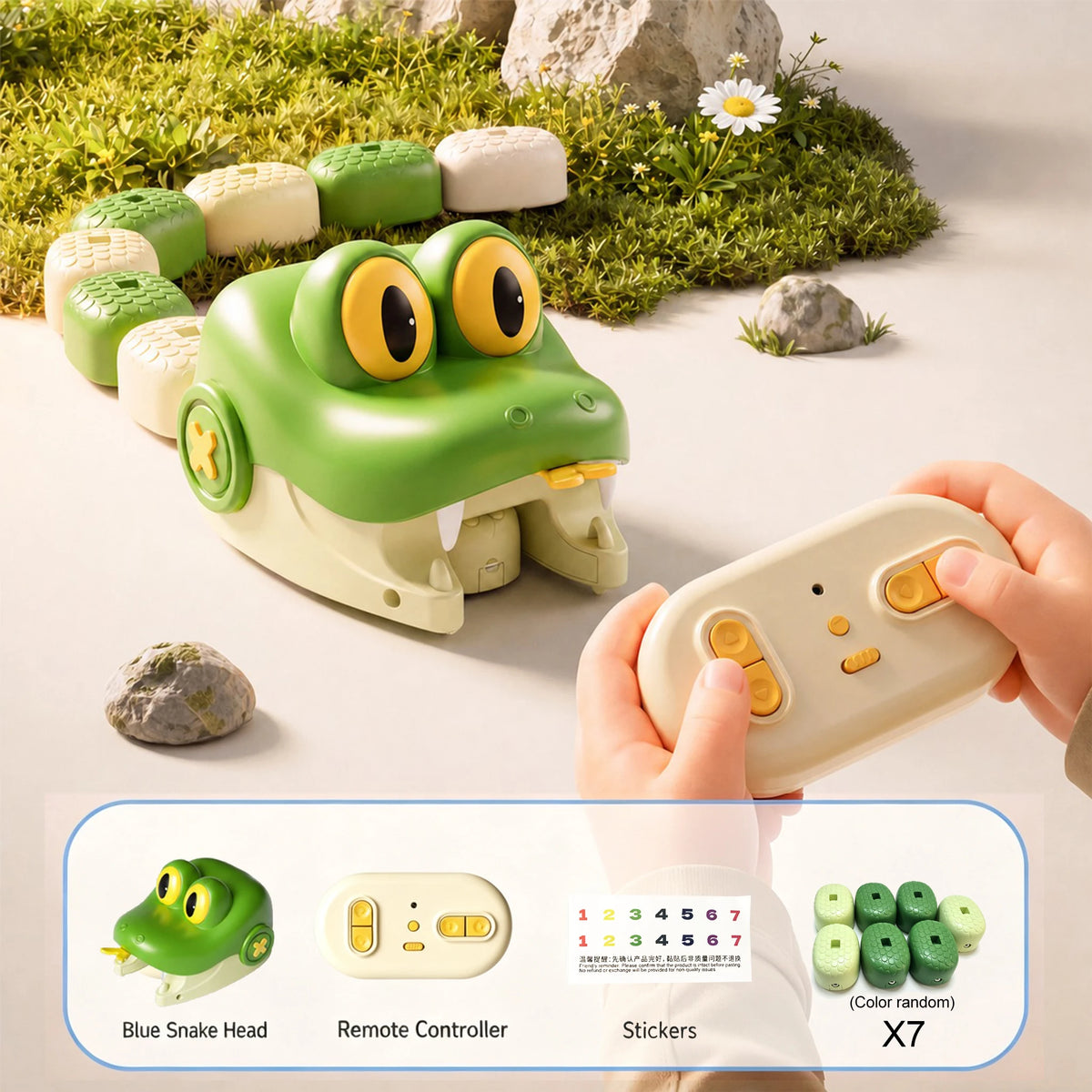 A green snake toy is shown next to its remote controller and stickers on a light surface.