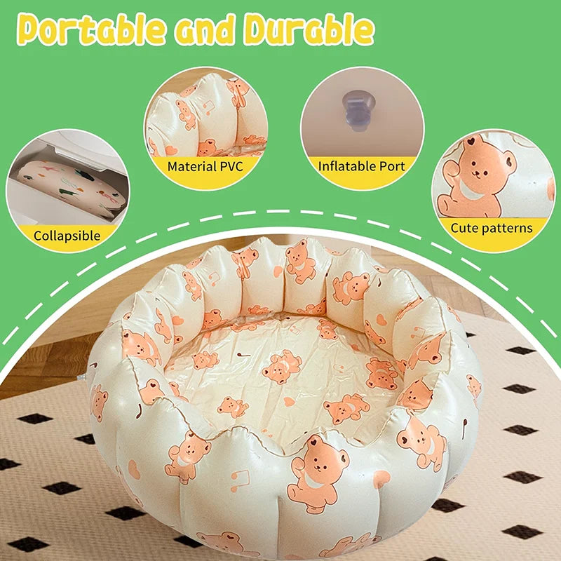 A round inflatable toddler pool with cute patterns for outdoor water and sand play.