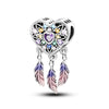 A heart-shaped sterling silver charm bead featuring pink zircon stones and attached feather elements.
