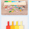 A set of wooden color matching blocks and a wooden tray with colored pegs for a Montessori toy.