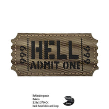 A brown woven patch with black text reading HELL ADMIT ONE featuring hook and loop closures.