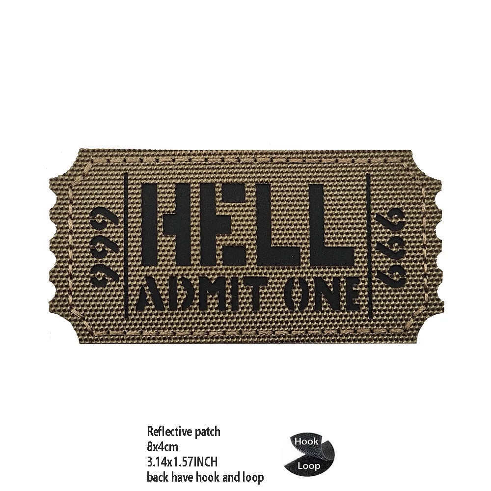A brown woven patch with black text reading HELL ADMIT ONE featuring hook and loop closures.