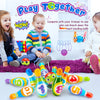 A colorful foam bowling set for kids featuring ten numbered pins and two soft balls laid out on a purple rug.