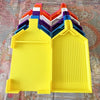 A set of colorful, pop-up trays for diamond painting beads, featuring a large yellow tray and multiple colored plugs.