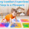 A colorful liquid sensory play mat with various colored liquids for kids is laid out on the floor.
