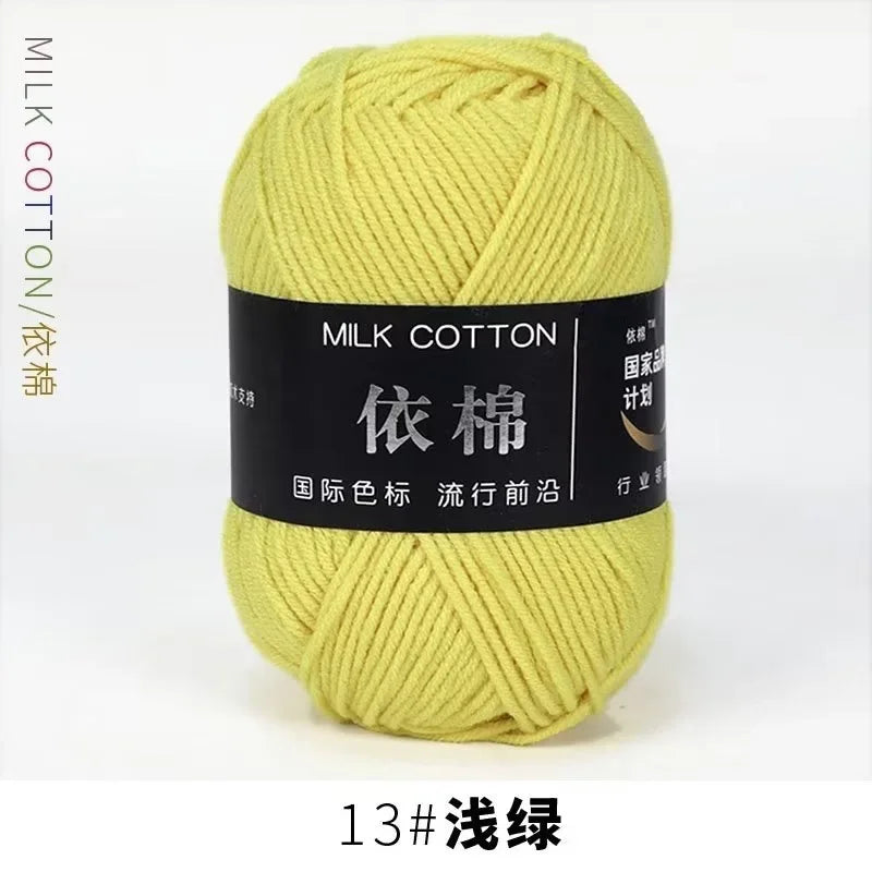 A ball of bright yellow milk cotton yarn labeled with Chinese characters and size 13