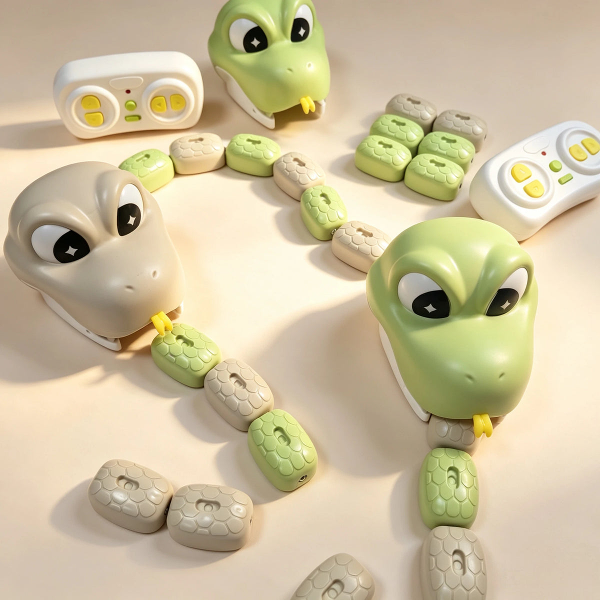 A magnetic snake toy featuring a head and body segments in light green and gray, arranged in a circular path.