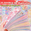 A hand holds a fan of colorful kawaii cartoon stickers for DIY crafts and school supplies