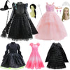 A collection of black and pink witch costumes, including a dress, a cape, and accessories.