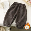 Dark gray fleece-lined pants with a subtle heart pattern, shown flat lay on a white surface.