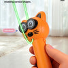 An orange automatic cat toy with black eyes and whiskers is held in a hand, demonstrating its high-speed dual-motor rotation.