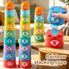 A set of eight colorful rainbow stacking cups for kids, showing various colors and numbers stacked vertically.