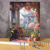 A paint by numbers kit depicting a traditional Chinese landscape featuring a wooden house and blooming pink flowers.