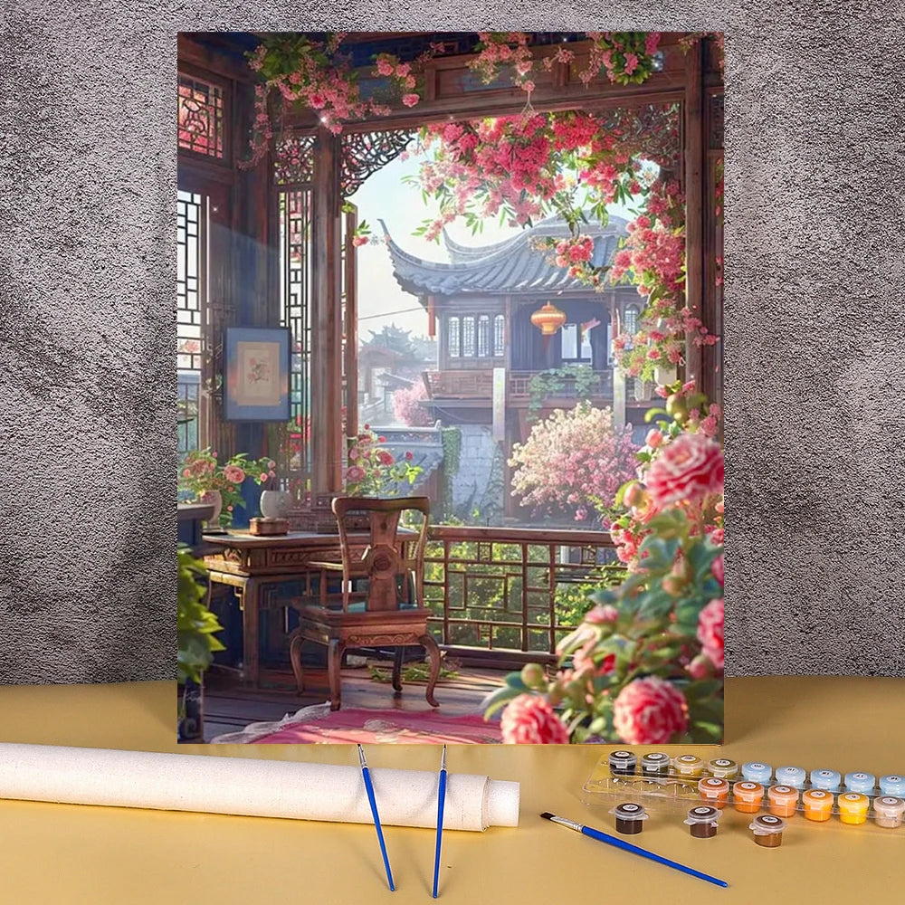 A paint by numbers kit depicting a traditional Chinese landscape featuring a wooden house and blooming pink flowers.