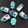 A set of seven floral resin potion bottle polyhedral dice, featuring various numbers and symbols.