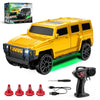 A yellow remote control drift car is shown with various accessories and packaging.