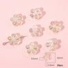 A collection of translucent, iridescent acrylic flower beads in various shades and sizes for DIY jewelry making.
