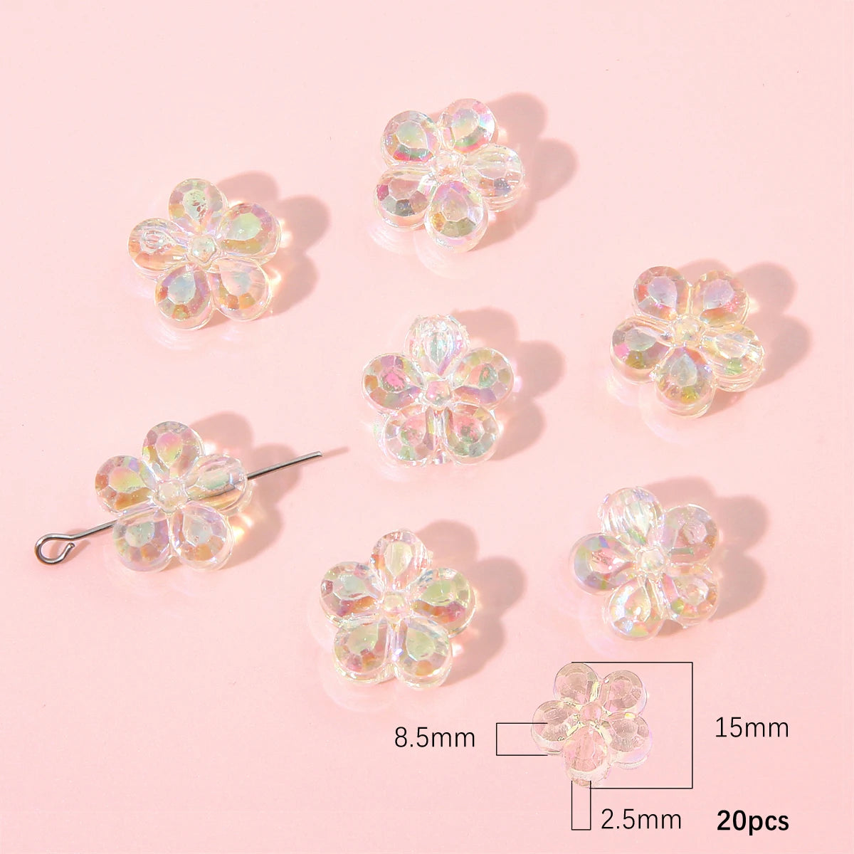 A collection of translucent, iridescent acrylic flower beads in various shades and sizes for DIY jewelry making.