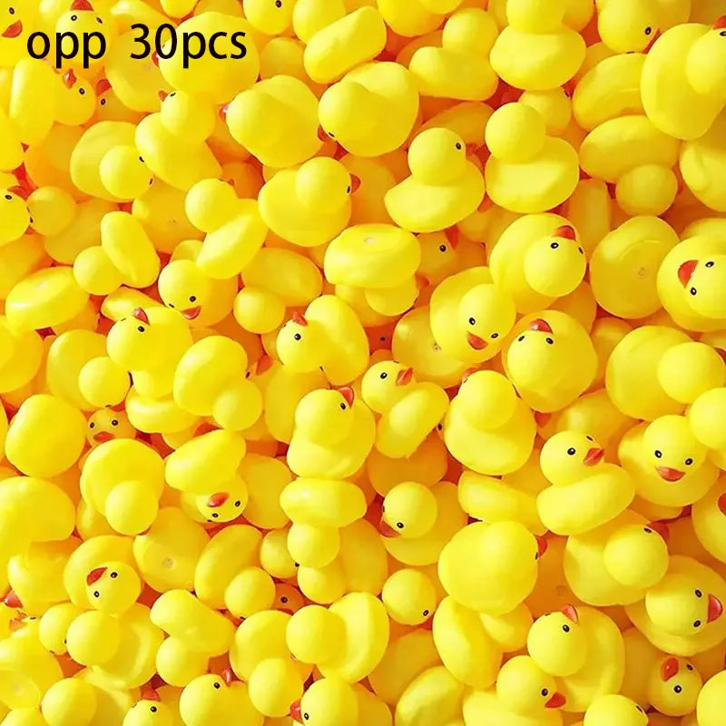 A pile of yellow squeaky floating duck bath toys made of soft silicone.