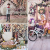 A mermaid theme party backdrop featuring a wooden castle and floral decorations with a child posing in front of it.