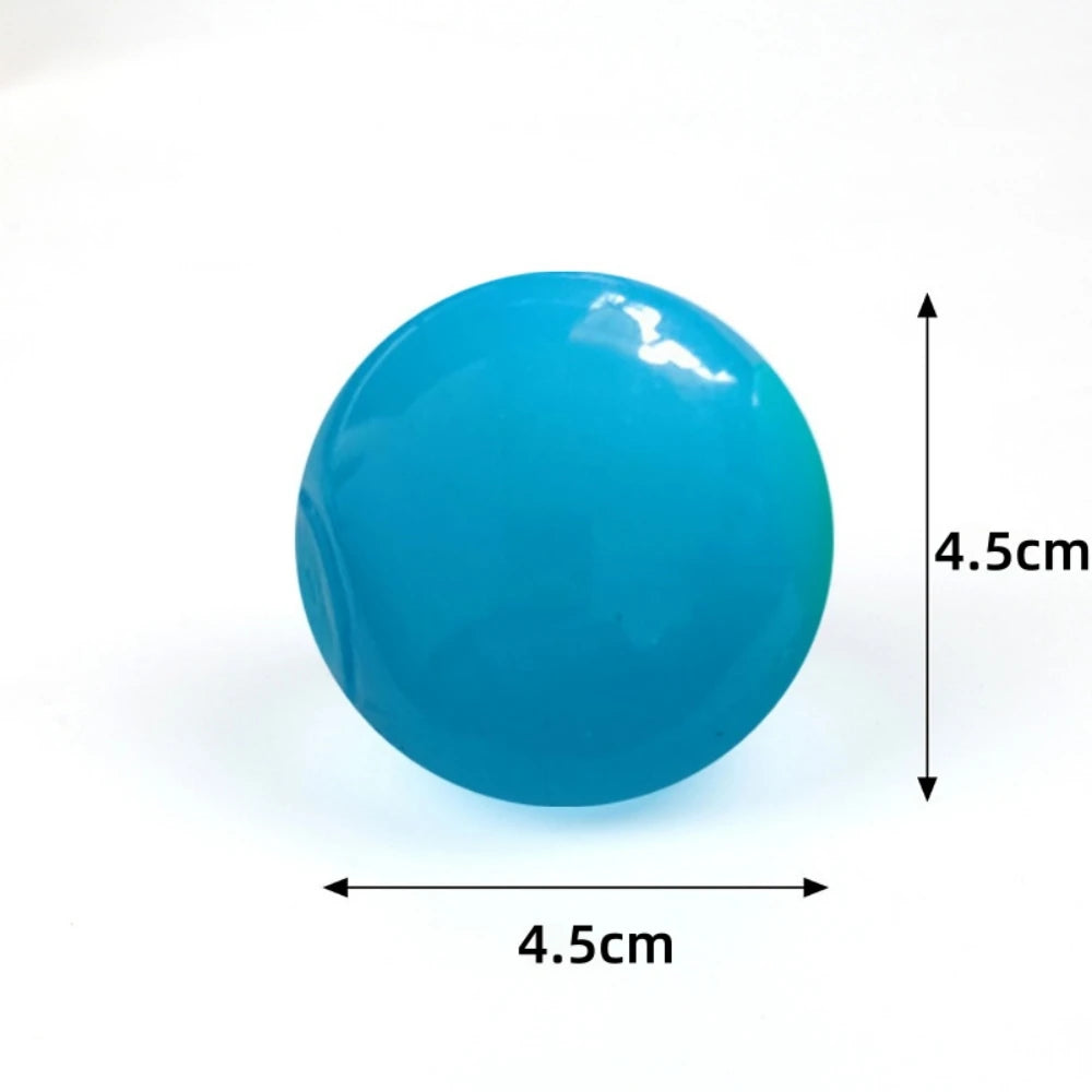 A bright blue glow-in-the-dark squishy stress ball with dimensions of 4.5cm in diameter.