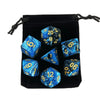 A set of polyhedral dice, including d20s and d12s, stored in a black fabric bag.