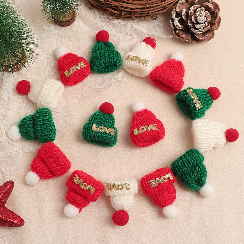 A collection of mini knitted red and green hats and scarves for doll dress-up accessories